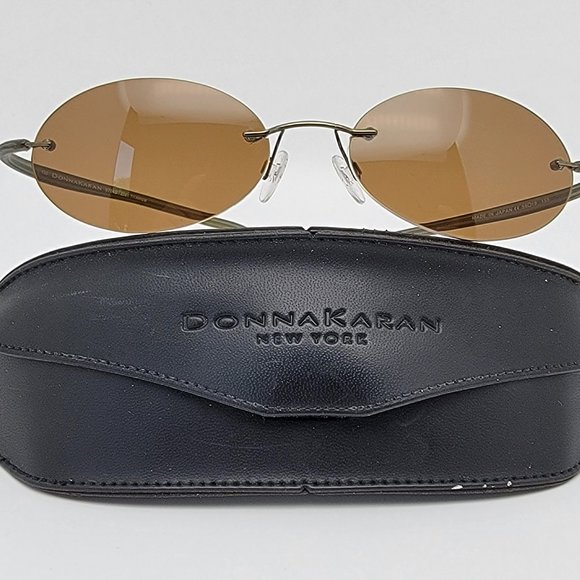 Donna Karan 9704S 250 Titanium Olive Green Frame Polarized Brown Lens Sunglasses
